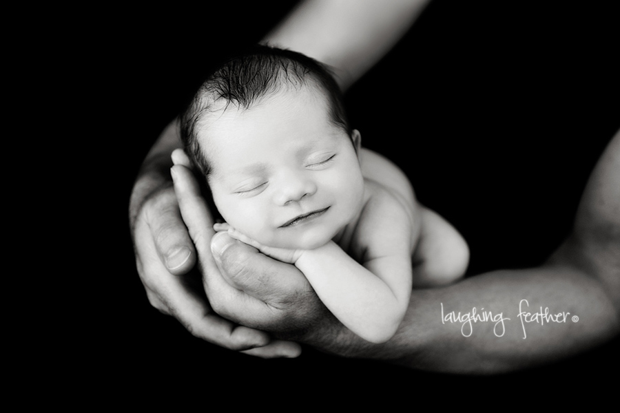 smiling newborn in fathers