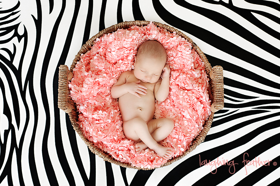 baby girl on Zebra skin mat